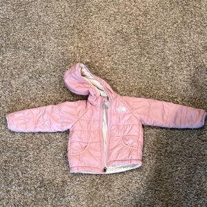 Pink/white reversible North Face Jacket.